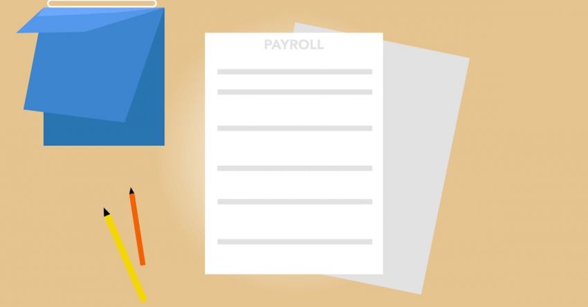 Debt Management - Payroll documents and calendar arranged on table with pencils