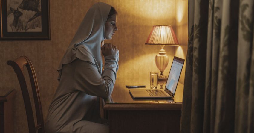 Home Office - A Woman Using a Laptop at Home