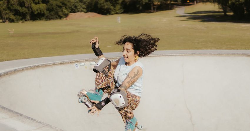 Outdoor Activities - Woman in Roller Skates Jumping